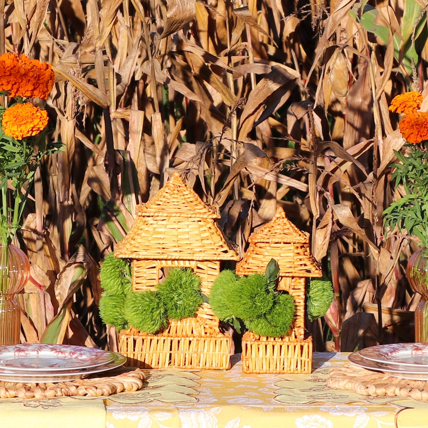 Pair of natural rattan pagoda lanterns, large and small sizes, displaying intricate handwoven details.