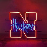 University of Nebraska Huskers Neon Light Sign glowing in red on metal grid backing