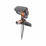 ZoomMaxx Oscillating Sprinkler on a metal spike standing in a green garden setting