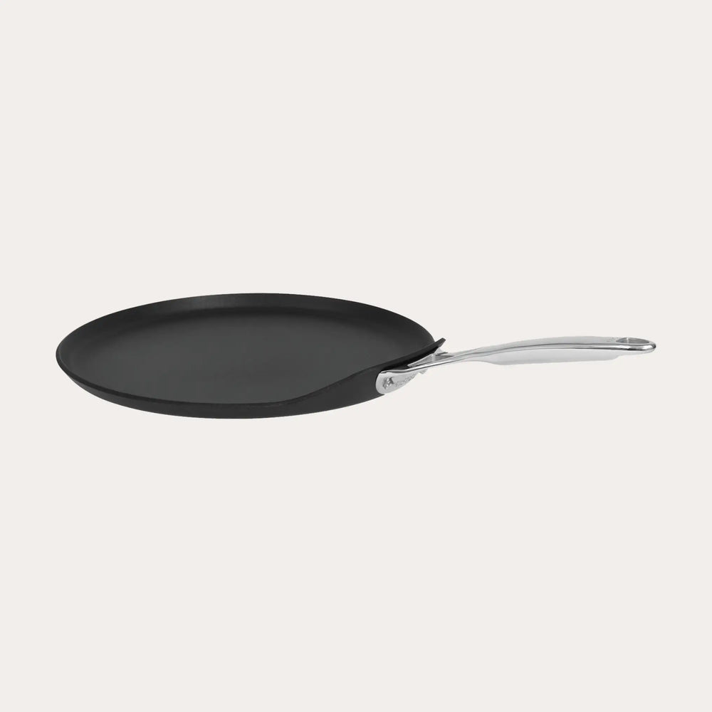 CRISTEL USA Crepe Pan with fixed stainless-steel handle on stovetop