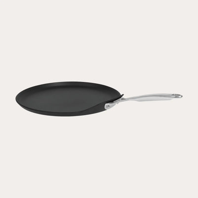CRISTEL USA Crepe Pan with fixed stainless-steel handle on stovetop