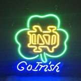 Green neon shamrock with yellow 'ND' initials inside and blue 'Go Irish' text below on a dark background.