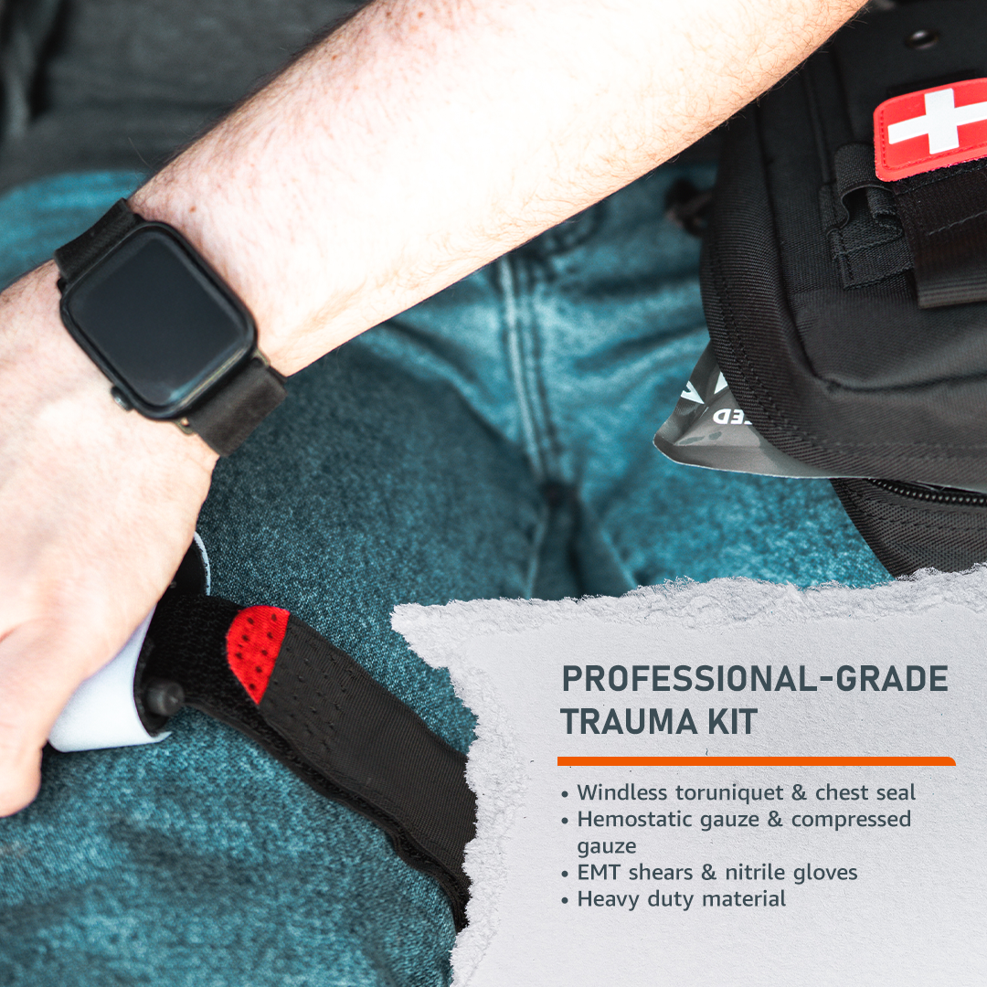 Person holding a black safety knife with a red tip, sitting on teal pants, next to a black bag with a white cross patch labeled as a professional-grade trauma kit.