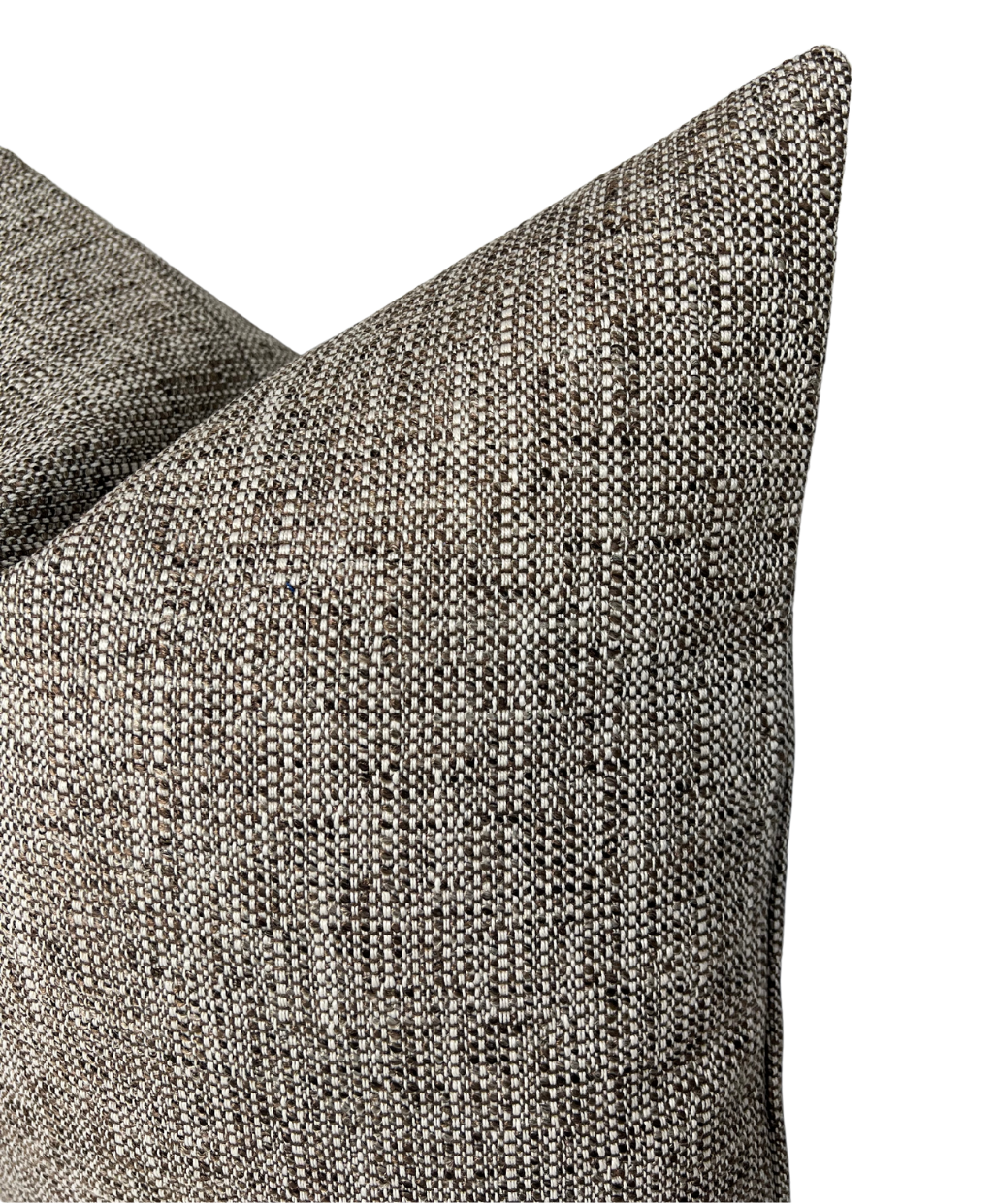 Close-up of two textured fabric pillow covers in a chestnut color with a woven pattern of dark brown, gray, and off-white threads, showing soft corners.