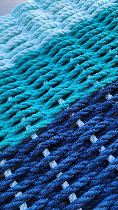 Handmade Ombre Rope Mat in Navy Blue, Teal, and Seafoam made with lobster rope