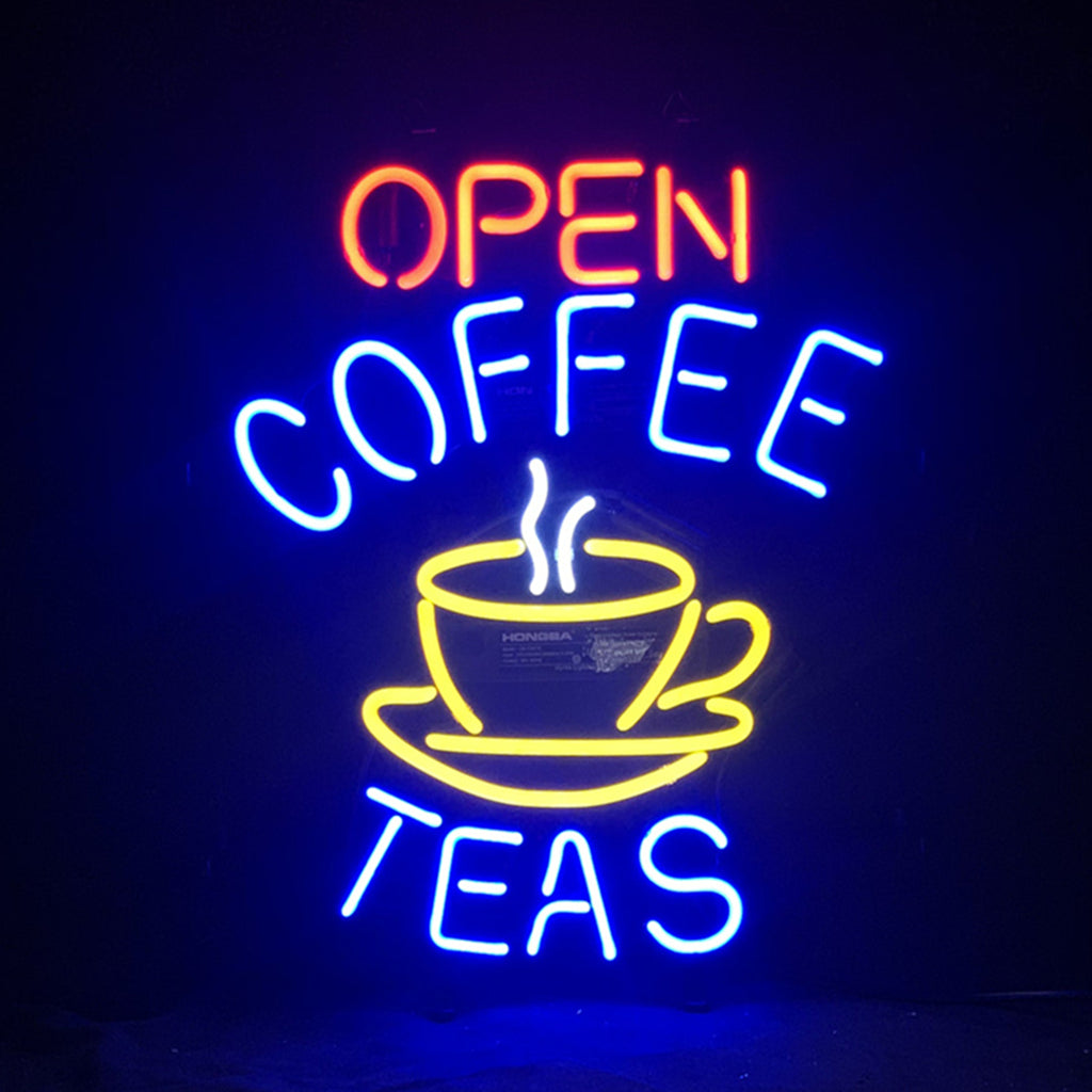 Open Coffee Teas Neon Sign with bright pink neon tubes against a metal grid backing