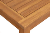 Close-up of a wooden side table corner with smooth, light brown wood slats arranged parallel and framed by a thicker border, showing fine wood grain texture.