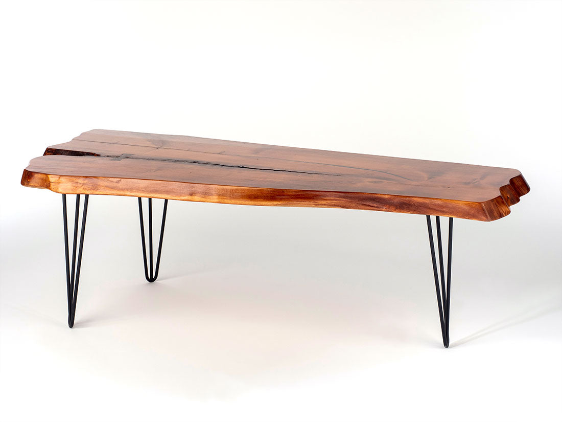Spalted Maple live edge center table with black epoxy accents, walnut bowtie, and slender hairpin legs in a room setting