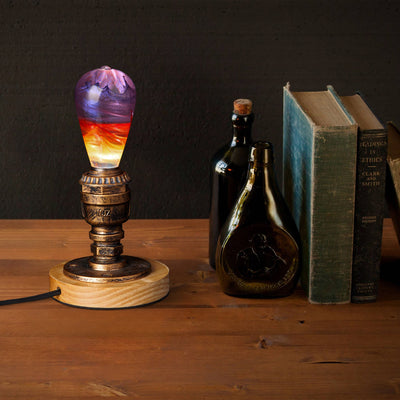 Passion Light Bulb decorative resin LED lamp with artistic glow, shown with wooden base options
