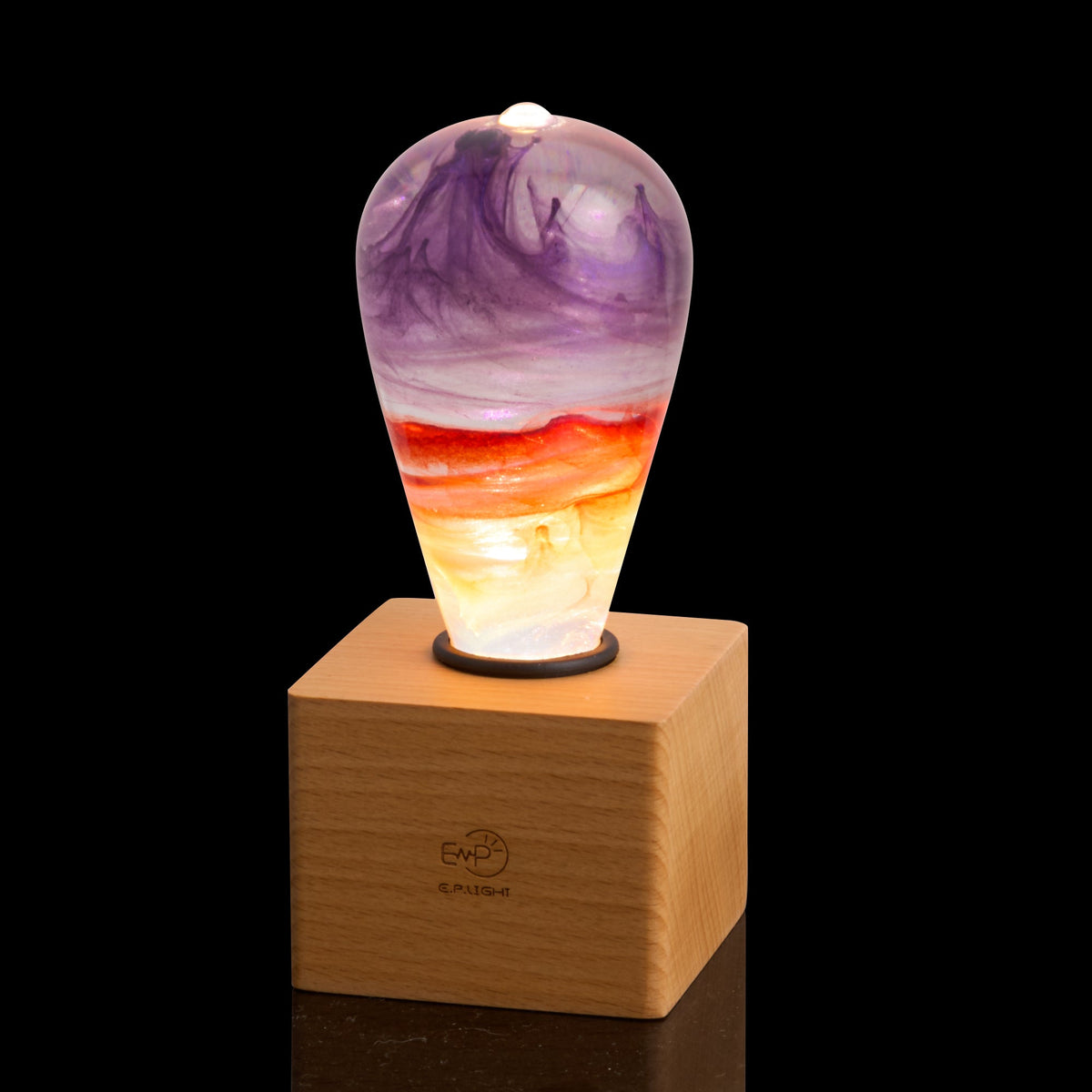 Passion Light Bulb decorative resin LED lamp with artistic glow, shown with wooden base options