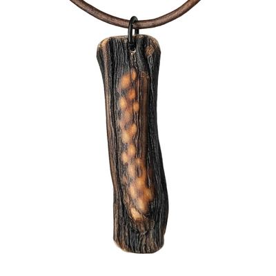 Halimea pendant necklace by Versiliy, organic textured pendant on leather cord