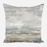Square pillow with a muted abstract seascape design in shades of gray, beige, and blue, resembling calm waters and a cloudy sky.