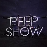 White neon tubing spelling 'PEEP SHOW' mounted on a black frame against a dark background with visible electrical cords