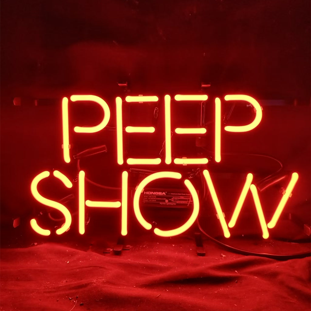 Bright red neon sign spelling "PEEP SHOW" in uppercase letters against a dark background, with glowing bent tubing and visible wiring beneath.