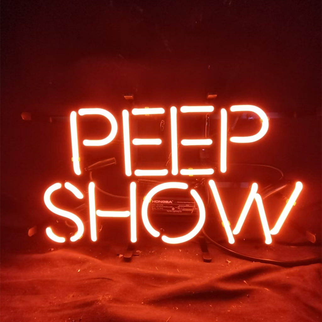 Peep Show Neon Signs mounted on a wall, glowing brightly against a dark background