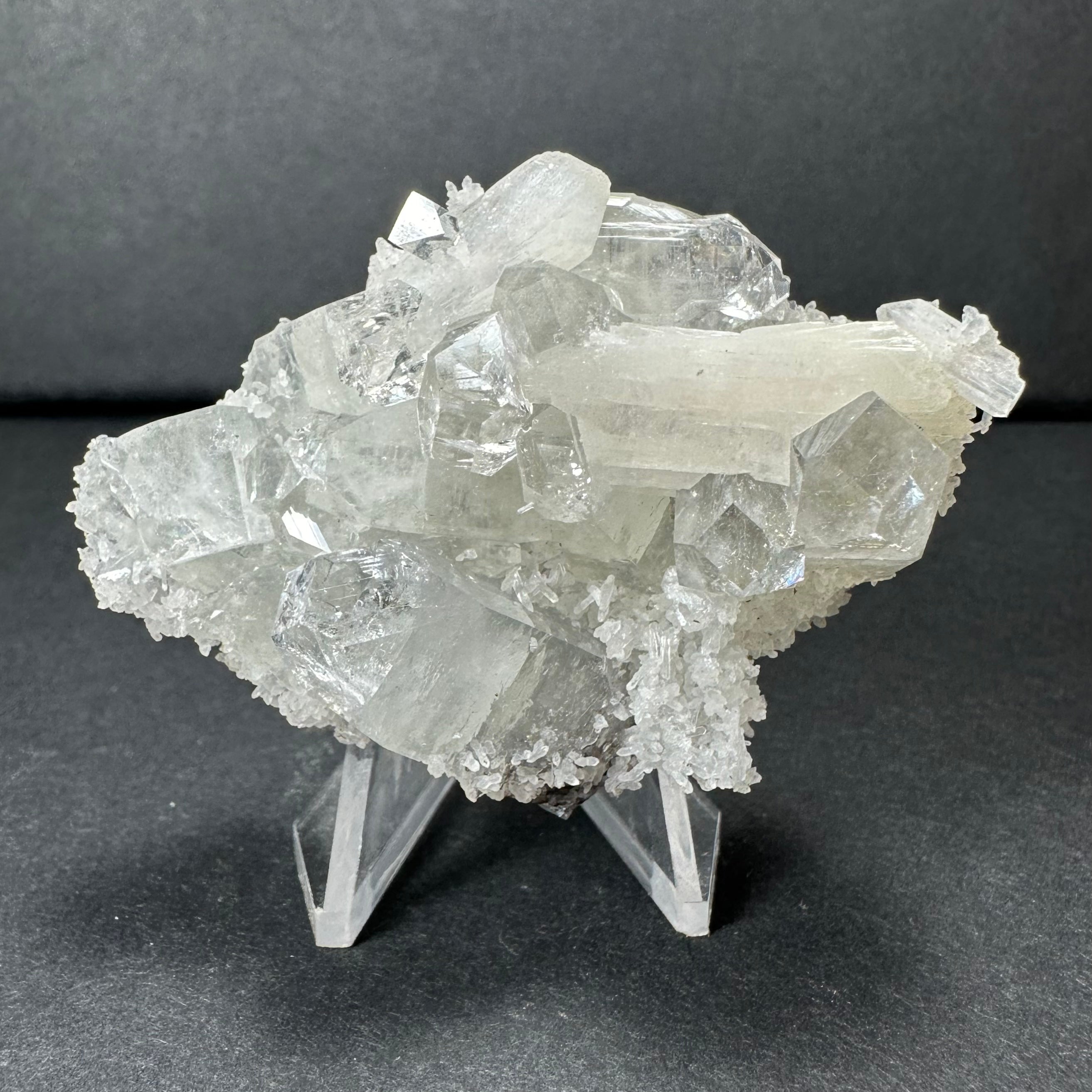 Clear Apophyllite crystal cluster with white Stilbite on a Chalcedony base against white background