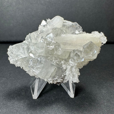 Clear Apophyllite crystal cluster with white Stilbite on a Chalcedony base against white background