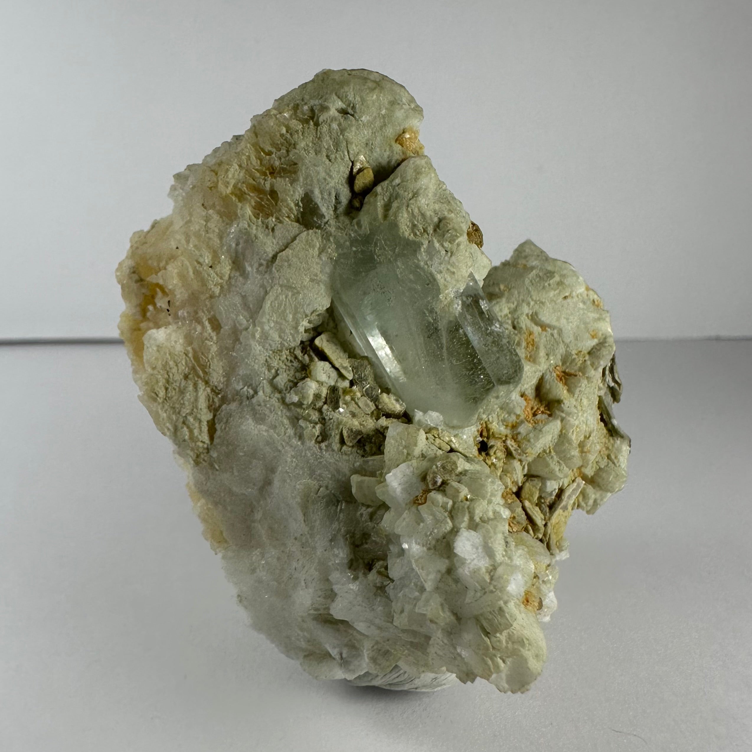 Aquamarine crystal atop feldspar, albite, and mica matrix specimen from Nuristan Province, Afghanistan