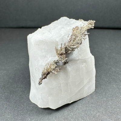 Native dendritic silver crystals on a calcite base mineral specimen from Morocco
