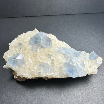 Celestite Crystals with Scalenohedral Calcite mineral specimen on matrix showing blue and creamy crystal formations