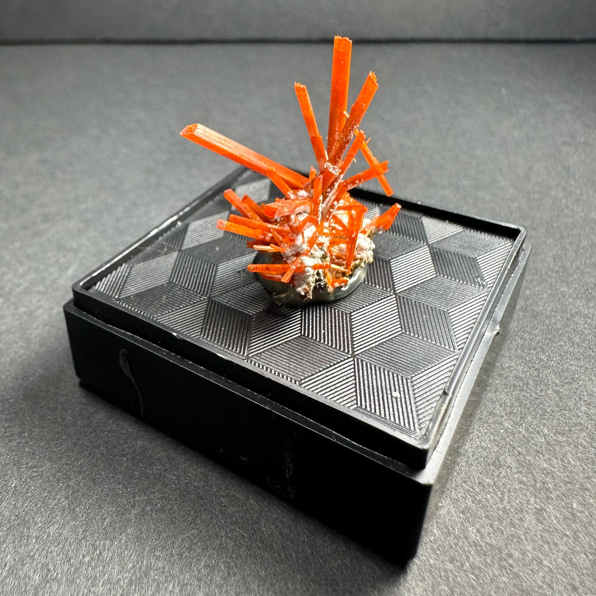 Crocoite on Matrix mineral specimen displayed in a clear acrylic case