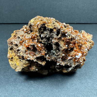 Wulfenite cluster on matrix from Maoniuping Mine, showing vivid orange crystals