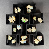 Welo Opal specimen from Ethiopia in a small square clear acrylic box.