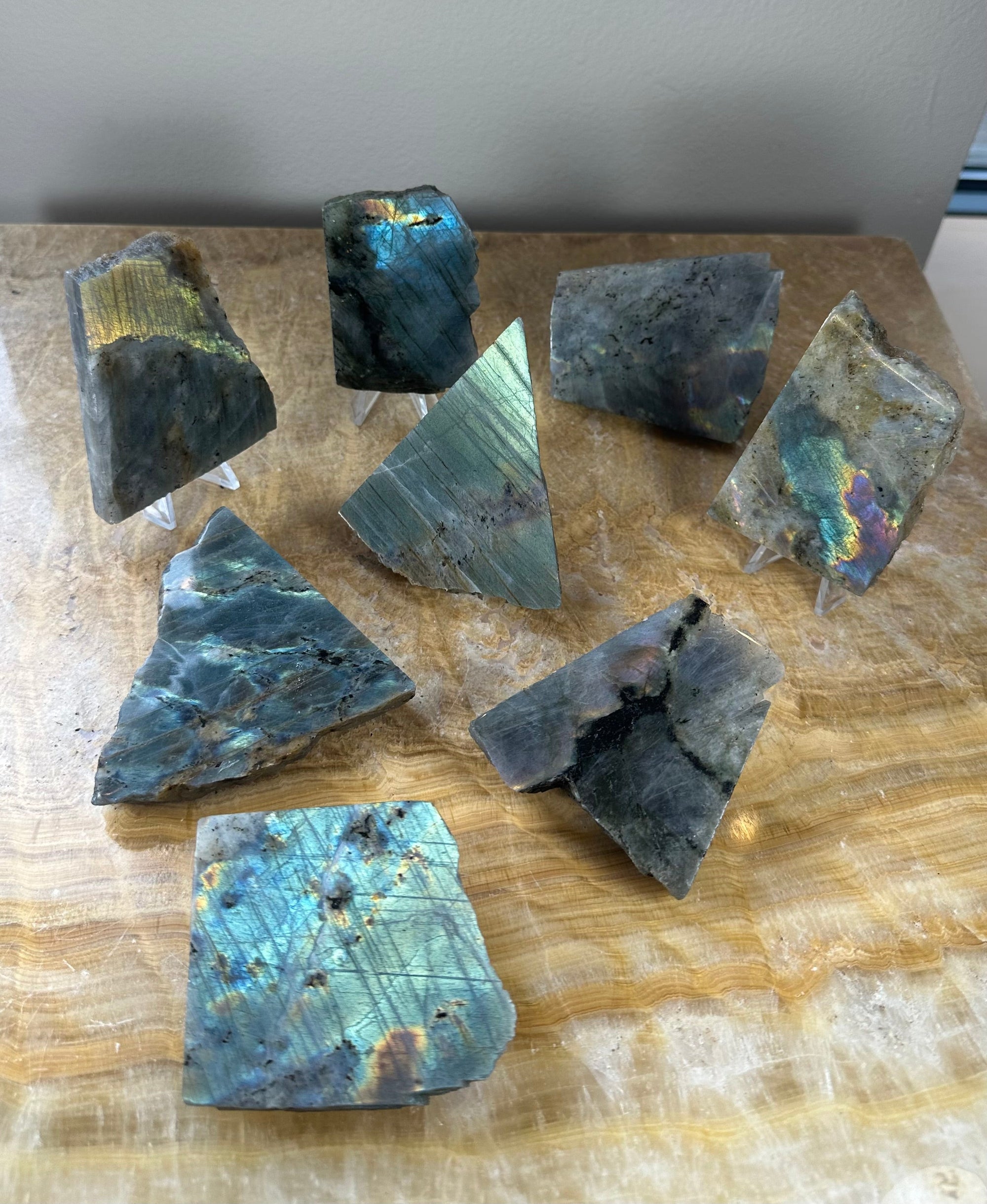 Two polished one-sided Labradorite slabs displaying diverse colors and textures