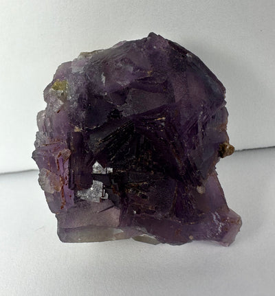 Purple Cubic Fluorite mineral specimen with cubic formations on matrix