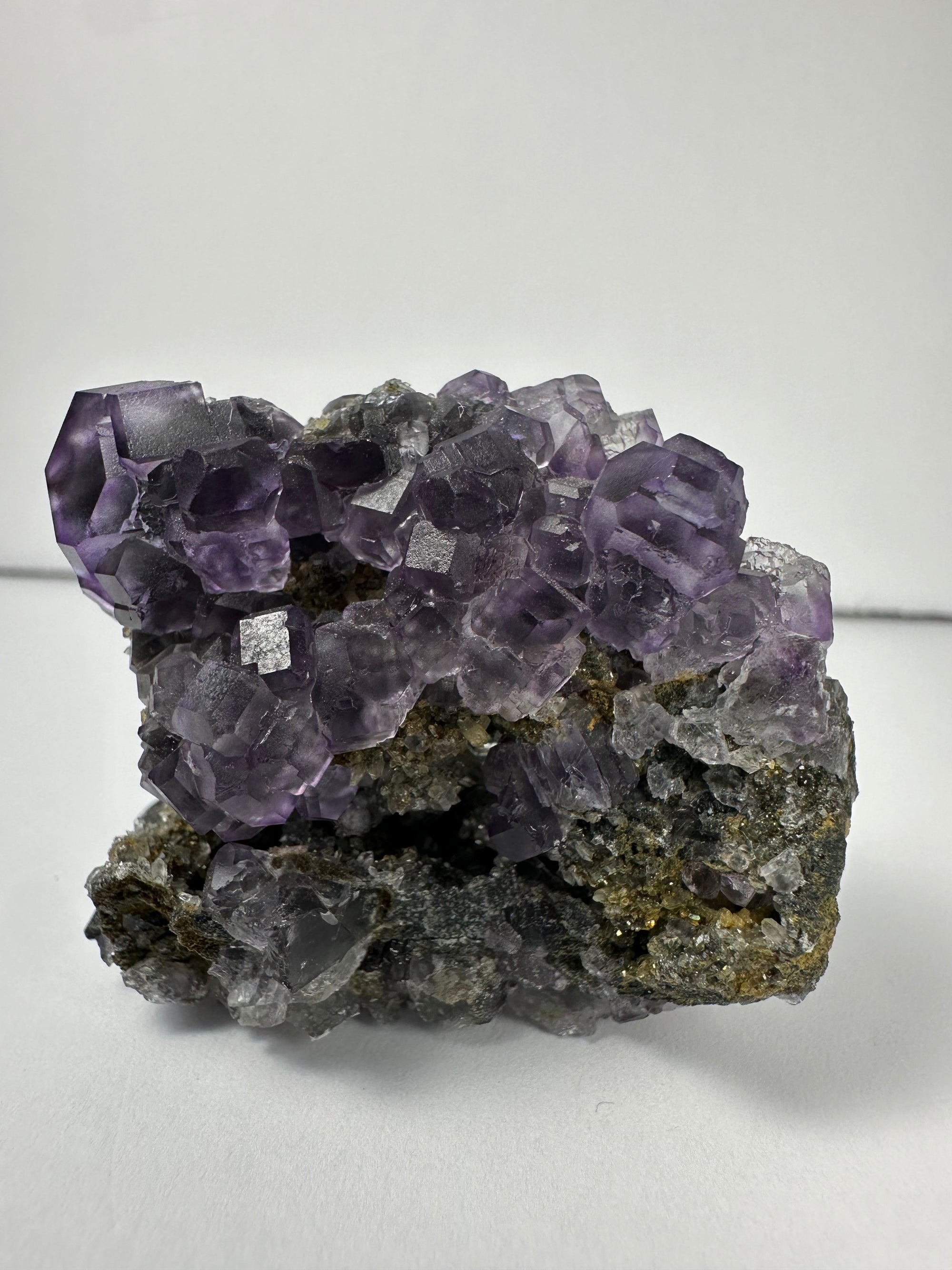 Purple dodecahedral fluorite crystals on a calcite matrix from China