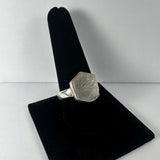 Natural rough quartz ring on a white background illustrating unpolished quartz stone set in sterling silver band