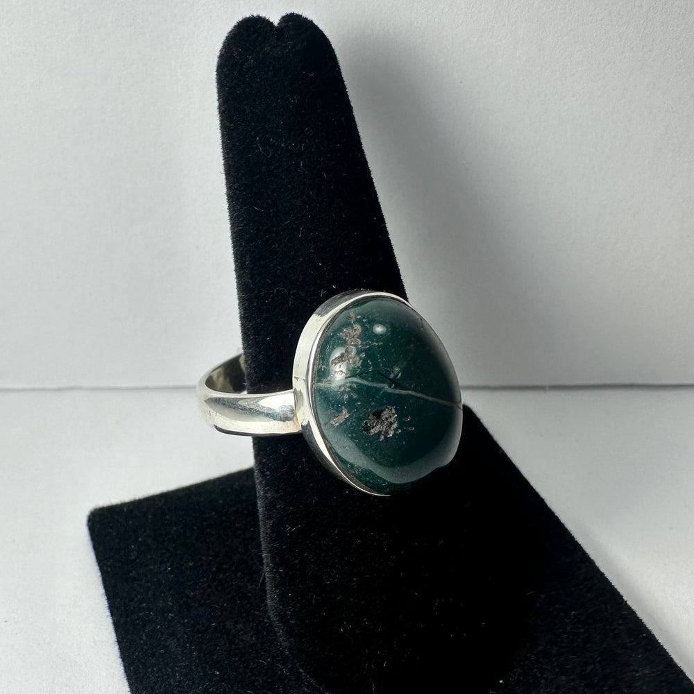 Close-up of Serpentine ring with green gemstone set in a polished silver band