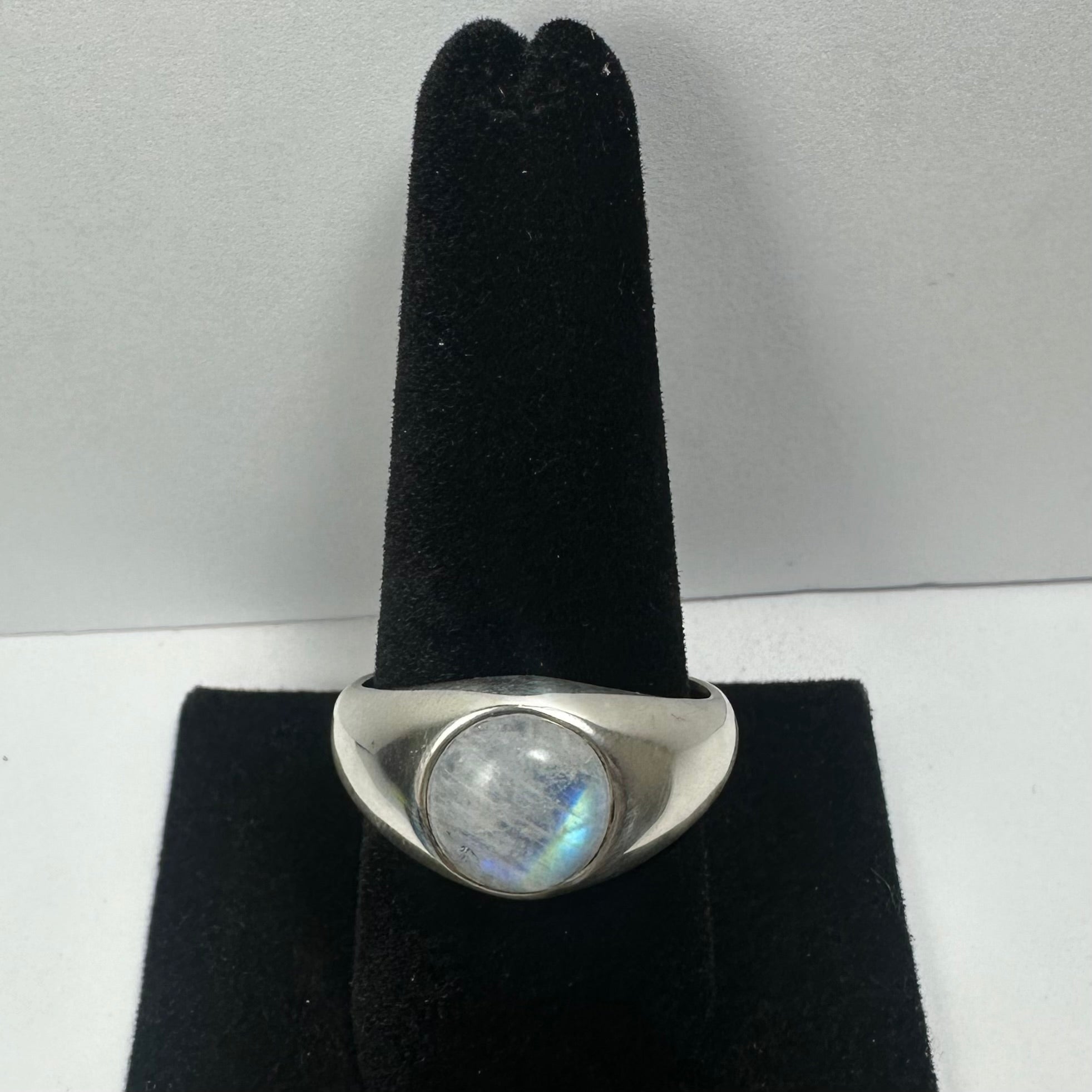 Moonstone Ring Size 11.5 made of sterling silver, displayed on a neutral surface