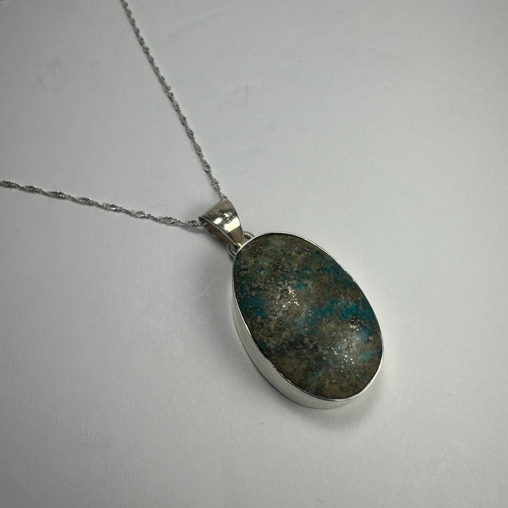 Turquoise Pendant featuring a vibrant blue stone set in sterling silver