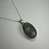 Turquoise Pendant featuring a vibrant blue stone set in sterling silver