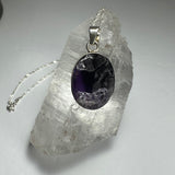 Natural rough amethyst pendant with dark purple stone and silver clasp