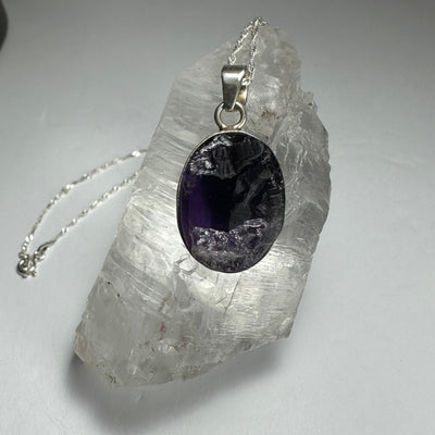 Natural rough amethyst pendant with dark purple stone and silver clasp