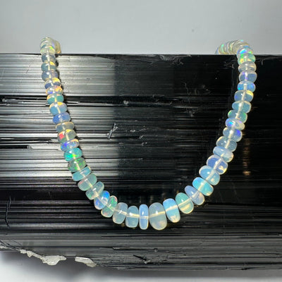 Welo Opal Graduated Bead Necklace from Ethiopia showing translucent opal beads on a white background