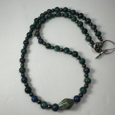 Handmade Tibetan Brass & Turquoise Necklace shown close-up with bead and pendant details