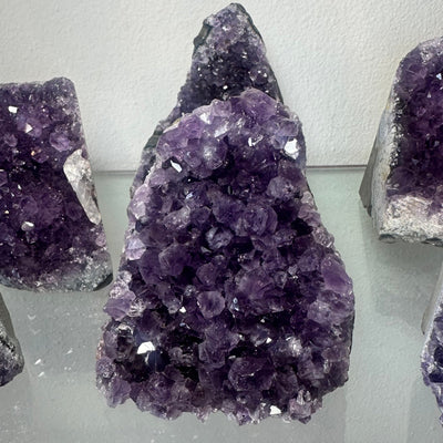 Medium cut base Amethyst Druze specimen from Uruguay with vibrant purple crystals on a base