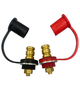 Pair of brass remote battery post connectors with threaded mounts, one red and one black, each with a matching color-capped protective cover attached by a flexible strap.