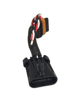 Black automotive plug and play wiring harness with coiled black protective sleeve and red, white striped twisted wire on white background.