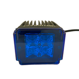 Black LED pod with a blue translucent rectangular lens cover and four visible LED bulbs inside, shown from the front with cable extending from the side.