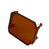 Rectangular amber-colored transparent plastic cover with rounded corners and small mounting tabs on two sides, shown against a white background.