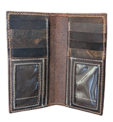 Brown leather bifold wallet open to show six card slots and two clear ID windows with white stitching details