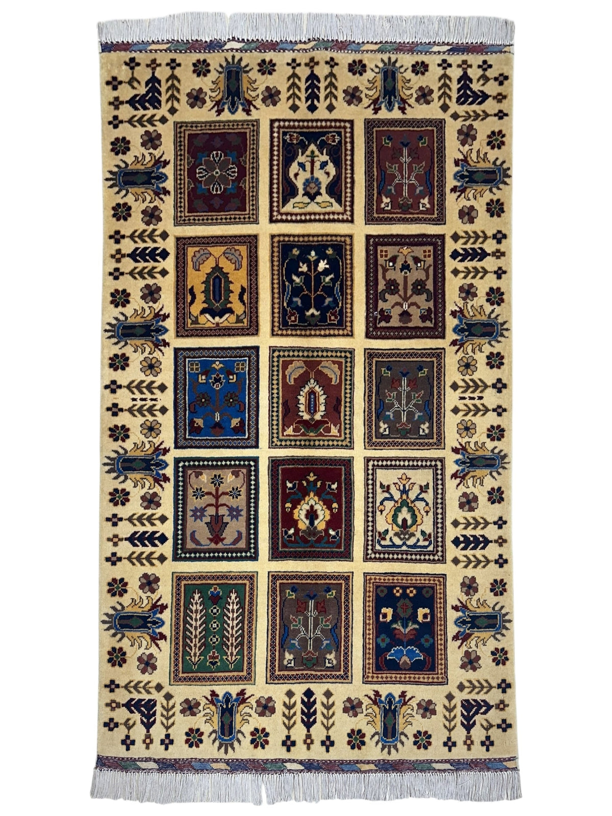 Hand-knotted Afghani Bakhteiari cream wool rug laid on wood flooring