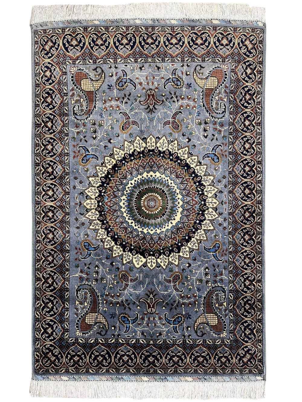 Hand-knotted gray Parak rug with geometric patterns, laid on wooden floor