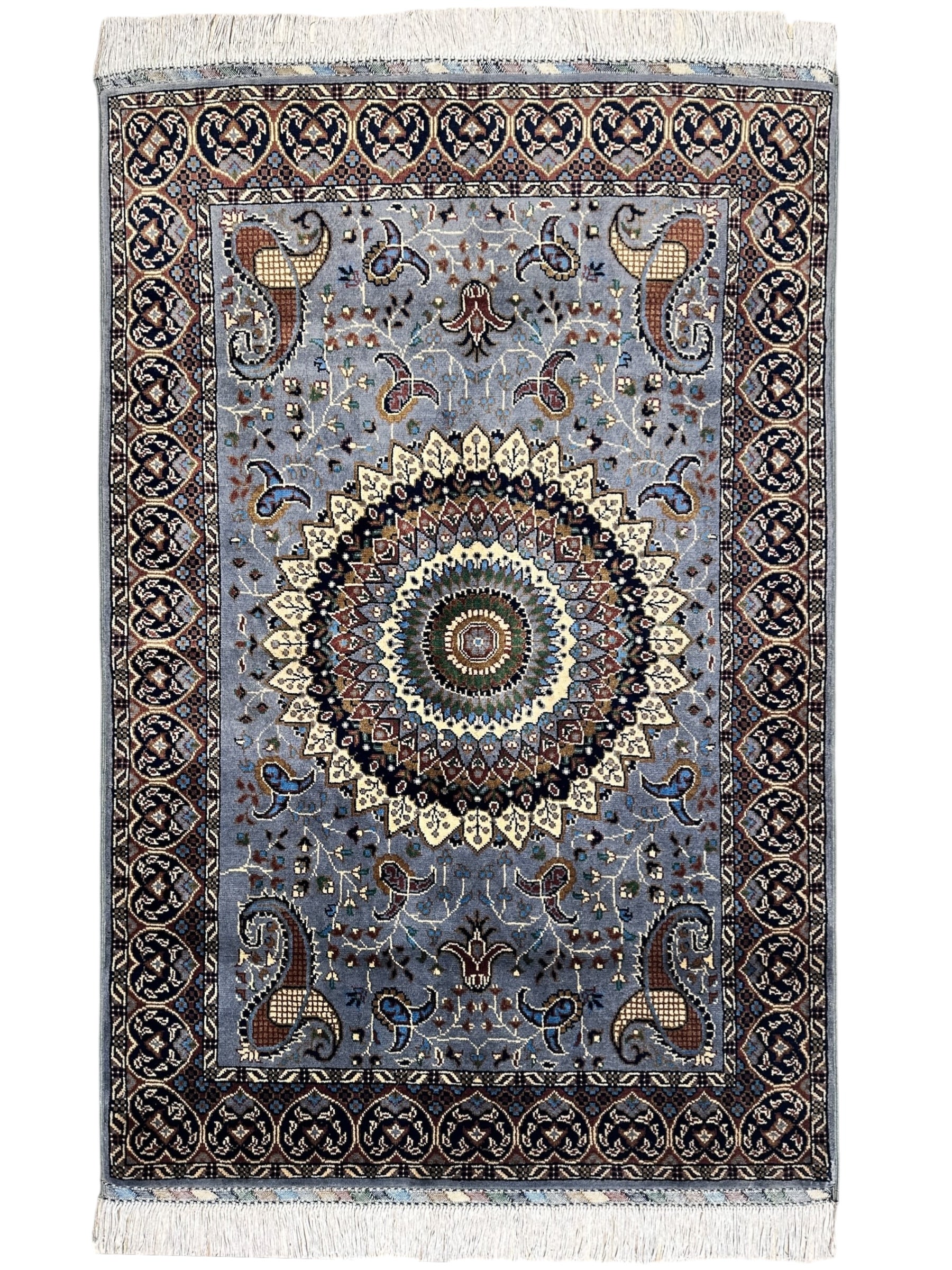 Hand-knotted gray Parak rug with geometric patterns, laid on wooden floor