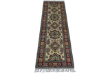 Rectangular hand-knotted Afghani Kazak wool rug with geometric medallions on a cream field and a red border featuring floral and tribal motifs, finished with fringe.