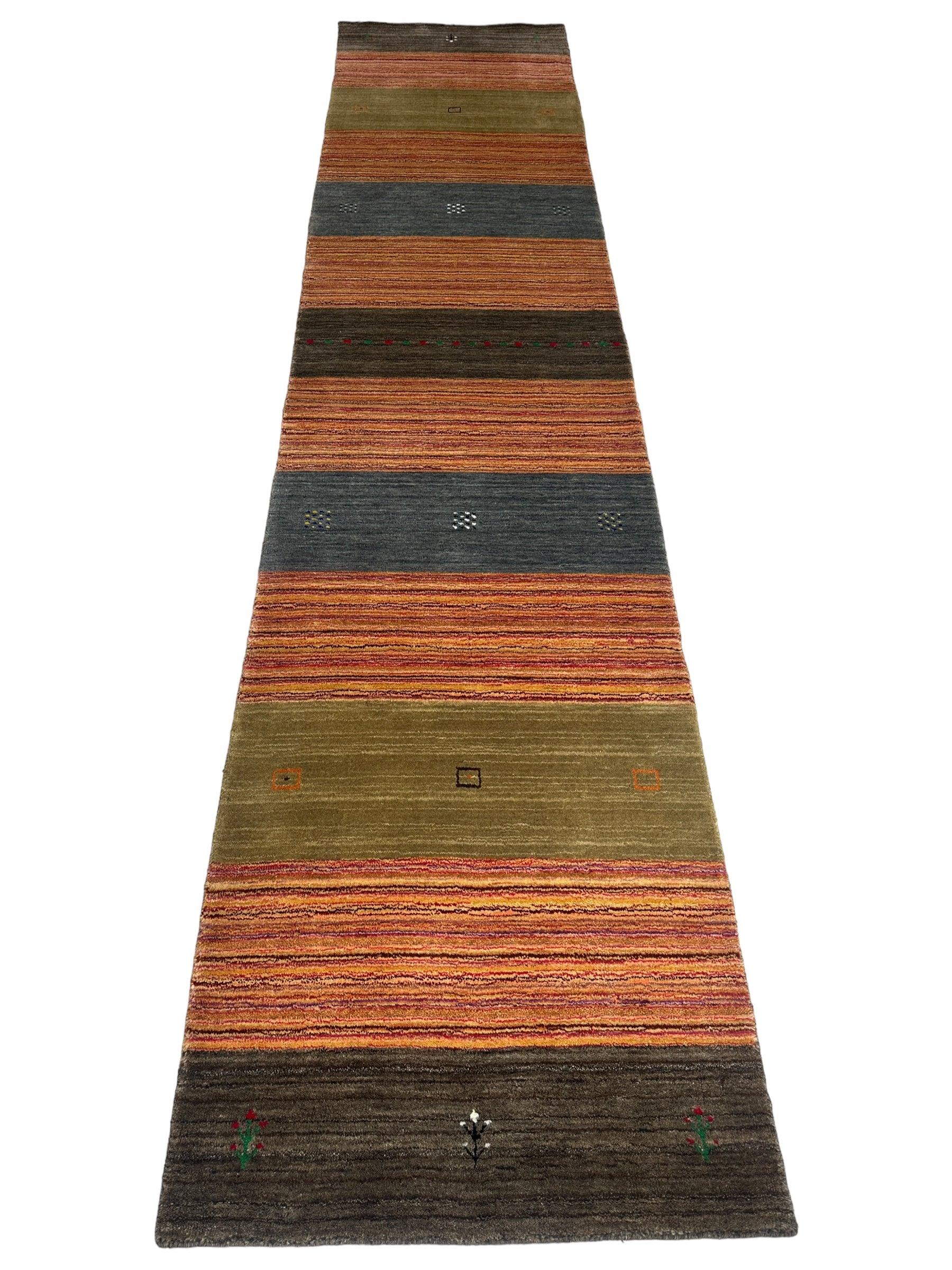 Hand-loomed Indo-Gabbeh Runner Rug laid out on a wooden floor showing detailed pattern